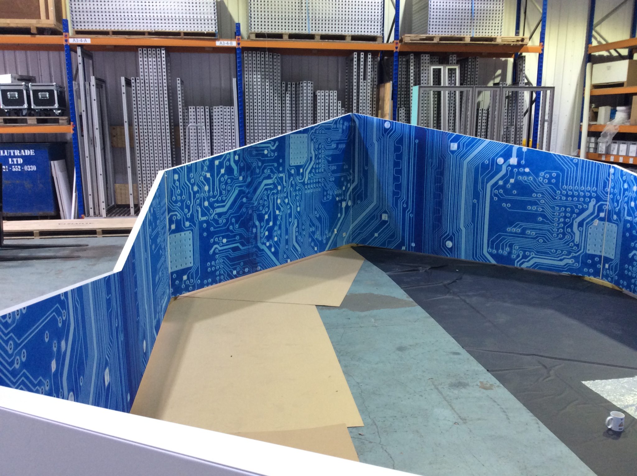 Moss UK Angled tension fabric, fabricated in six sections with flowing image.