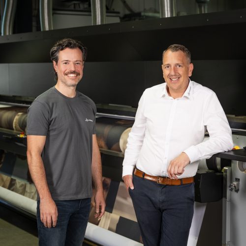 Christos Pappas, Director Print Technologies Europe, and Peter Bottenberg, Managing Director of Moss Europe, in front of their 5m Durst Printer.