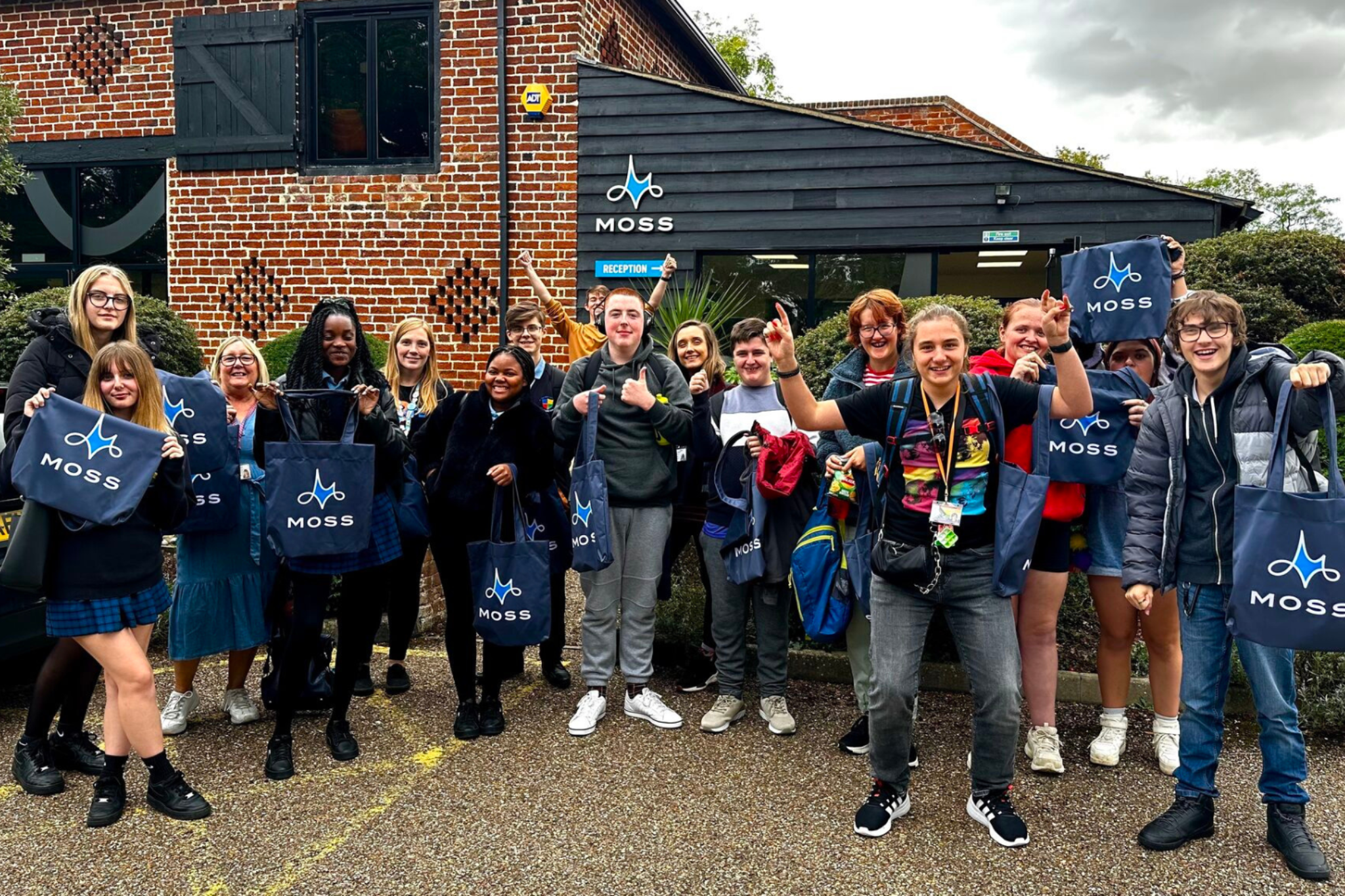 Young people with their branded Moss bags